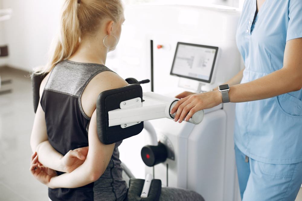 A doctor examining a patient after a truck accident, emphasizing the importance of diagnosing all injuries promptly.